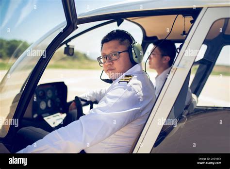 chinese pilot teaching trainee  operate control panel  cockpit