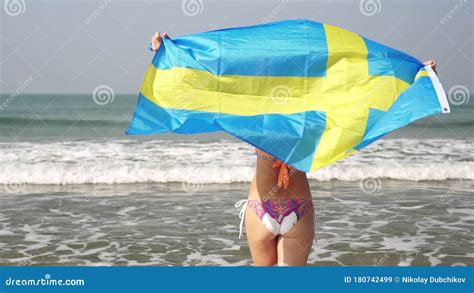 Woman With Sweden Flag On The Beach Girl In Bikini With Swedish Flag On The Sea Stock Video