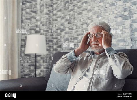 Frustrated Unhealthy Senior Mature Man Touching Head Having Painful