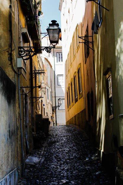 Premium Photo Alley Amidst Buildings In City