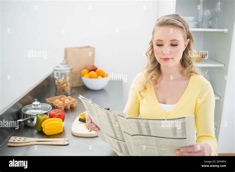 Happy Cute Blonde Holding Newspaper Hi Res Stock Photography And Images Alamy