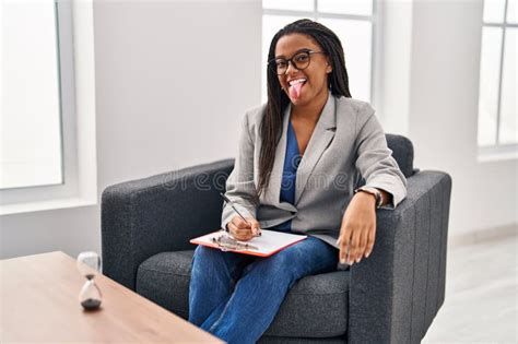 Young African American With Braids Working At Consultation Office