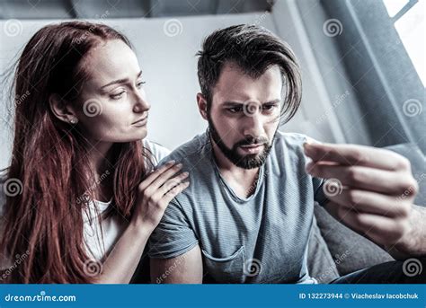 Serious Brunette Staring At His Fingers Stock Photo Image Of Compulsive Negativity
