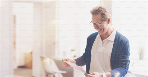 Workign Style Positive Smiling Male Office Worker Working With Papers
