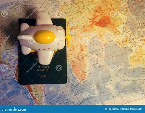 Close Up The Toy Airplane And Passport On The World Map Background