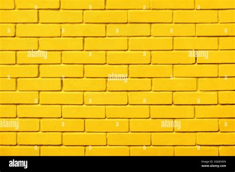 Painted bricks design yellow color wall background blocks. Natural design texture background ...