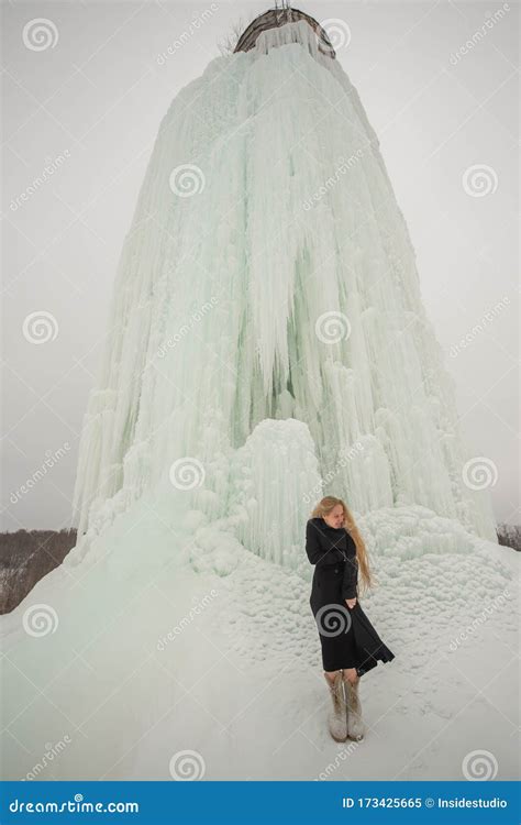 Naked Blonde Posing Near The Water Tower Woman Without Clothes In Winter Icy Water Stock