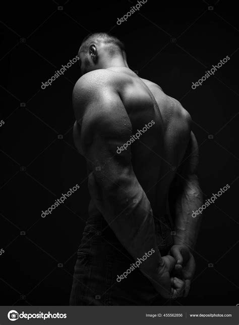 Strong Muscular Man Athlete Sportsman Is Standing Naked Shirtless With His Back To Camera