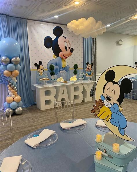 A Mickey Mouse Themed Baby Shower With Balloons And Decorations On The