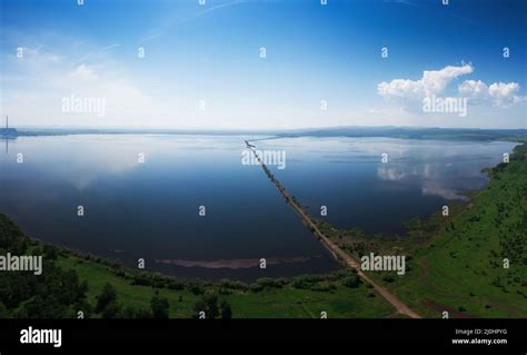 Aerial drone view of lake landscape with road Stock Photo - Alamy