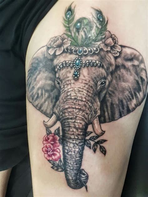 Elephant And Flowers Tattoo Elephant Tattoo Design Tattoo Designs Elephant Tattoos