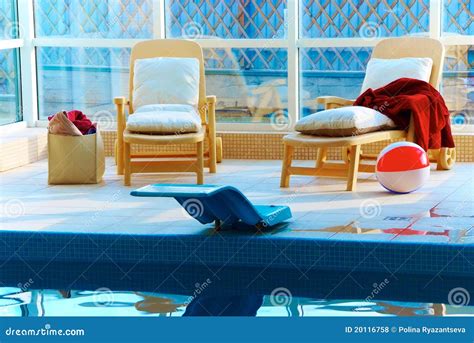 Beach chairs by the pool stock photo. Image of comfortable - 20116758