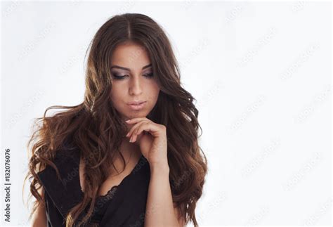 Sexy Brunette Woman Posing In Studio Girl With Long Curly Hair Stock Photo Adobe Stock