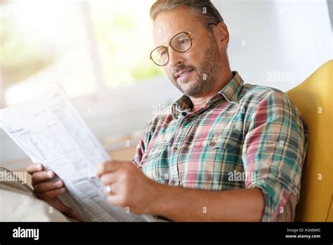 Mature Man With Eyeglasses Reading Newspaper Stock Photo Alamy