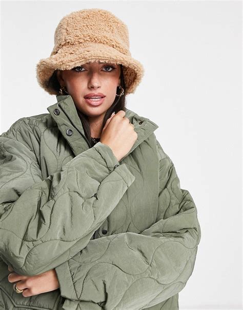 ASOS DESIGN Borg Roll Back Bucket Hat In Tan ASOS Asos Designs