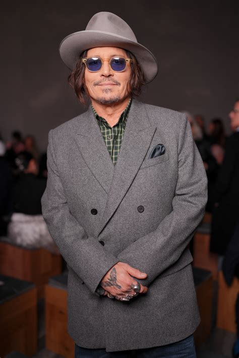 Johnny Depps Paris Fashion Week Outing Draws High Profile Company