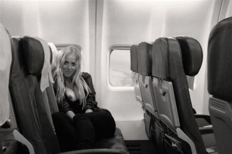 Exposing Her Tits On An Empty Airplane Porn Pic