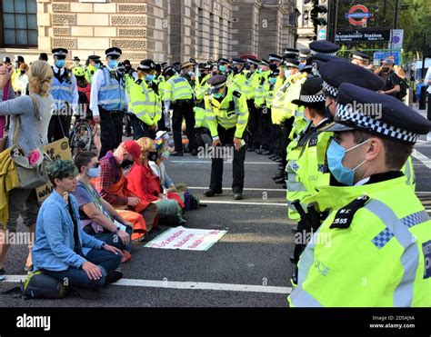 Protesters block the road in Parliament Square during the Extinction ...