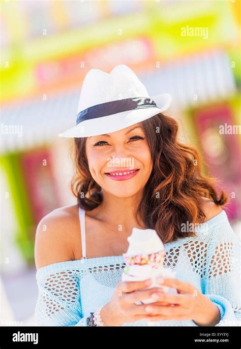 Chinese Woman Eating Ice Cream Cone Stock Photo Alamy