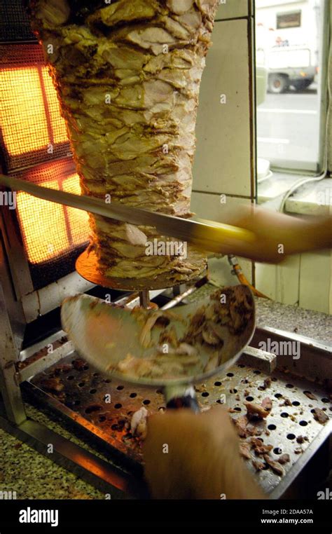 preparing  doener kebab sandwich   kebab stand popular fast food