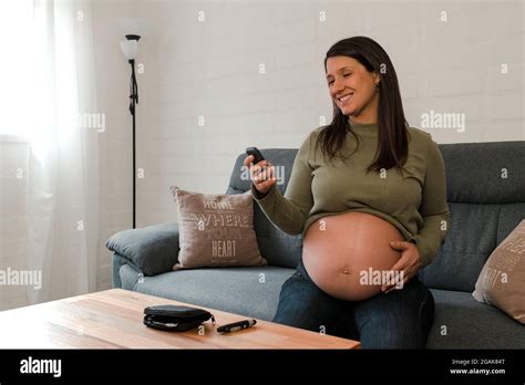 Pregnant Latina Woman Looking At Her Glucose Test Result And Smiling Stock Photo Alamy