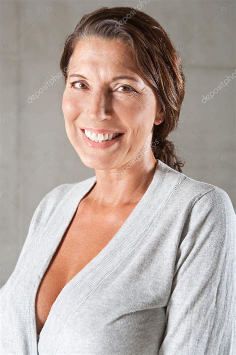 Portrait Of An Attractive Mature Woman Stock Photo By Mjth 79459818