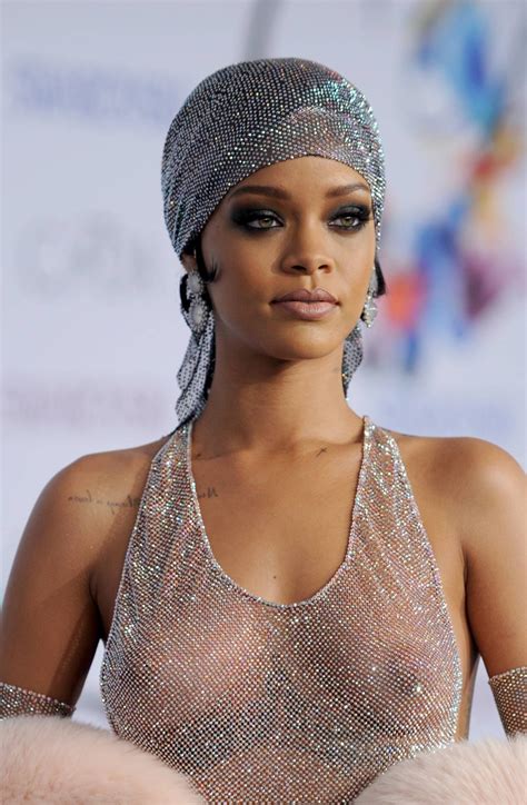 Hot Singer Rihanna Poses In A Transparent Dress Photos