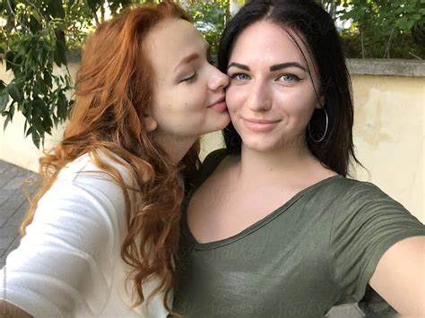 A Lesbian Couple Taking A Selfie Outdoors By Stocksy Contributor