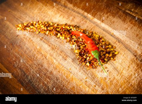 Red Hot Chilli Concept Chilli Sits Atop Chilli Seeds Shaped Like A Chilli Stock Photo Alamy