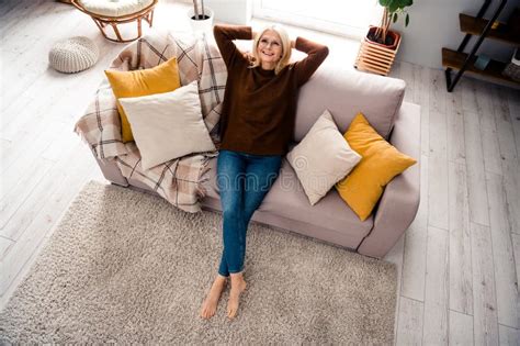 High Angle Photo Of Blonde Hair Mature Age Woman Take Nap On Gray Soft Couch Relaxing Sleepy