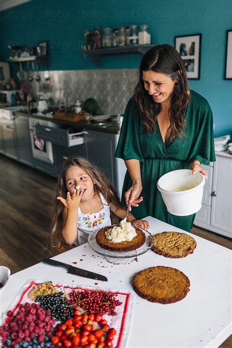 Mother And Daughter Baking A Delicious Naked Cake By Stocksy Contributor Peter Meciar Stocksy