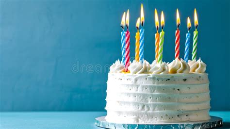 Celebration Time A Delicious Birthday Cake With Lit Candles In Vibrant