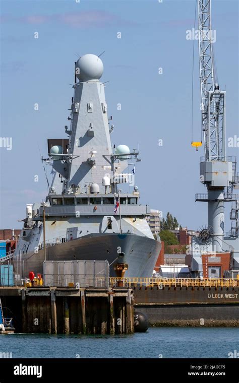 British Royal Navy Warships In The Naval Dockyards In Portsmouth On The