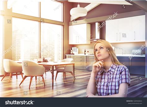 Thoughtful Blonde Woman Sitting Modern Kitchen Stock Photo 1640566822 Shutterstock