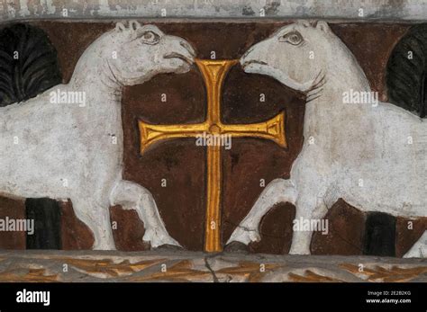 Pair Of Lambs Facing A Golden Cross Represents The Faithful Departed