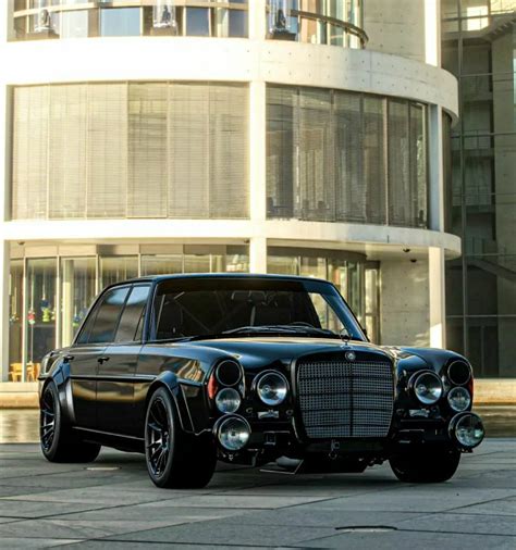 Classic Mercedes Benz Car Parked in Front of a Modern Building