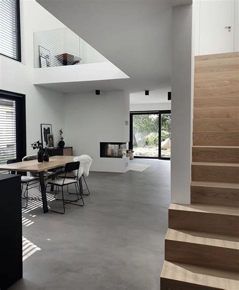 The Interior Of A Modern House With Stairs Leading Up To The Second