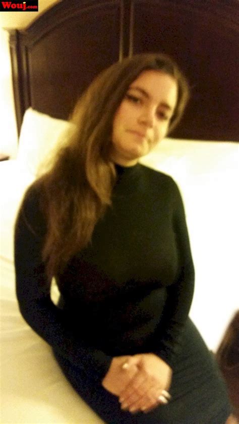 Pretty Brunette Hottie Loves Posing In Her Tight Black Dress Photos