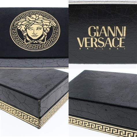 ジャンク Gianni Versace ジャンニヴェルサーチ 7009018 Gp G20 ゴールド×黒文字盤 ラウンド クォーツ レディース