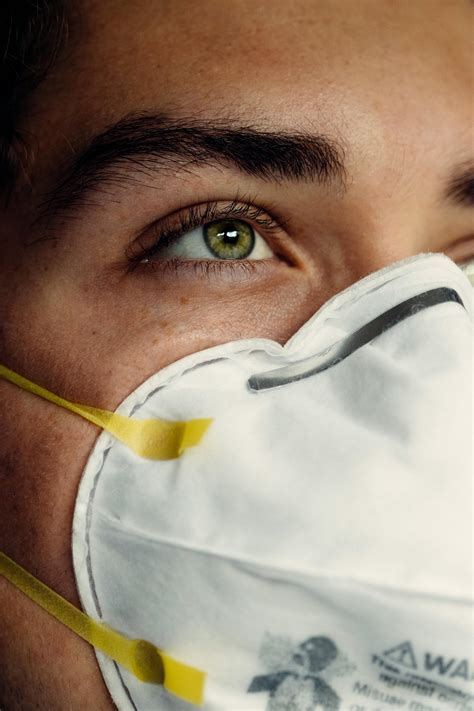 Person Wearing White Face MaskFree Stock Photo