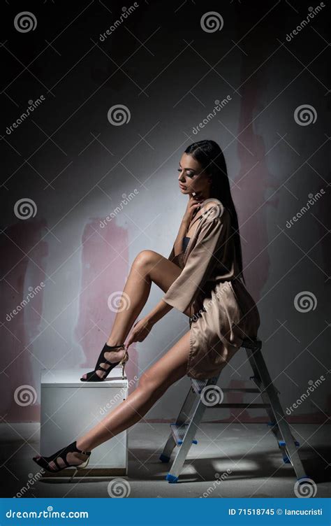 Sexy Legs In Nude Shoes And A Nude Bag Concept Sale And Accessories Royalty Free Stock