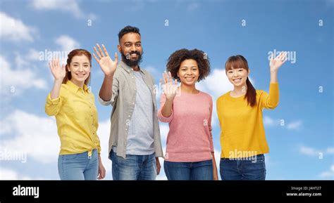 International Group Of Happy People Waving Hands Stock Photo Alamy