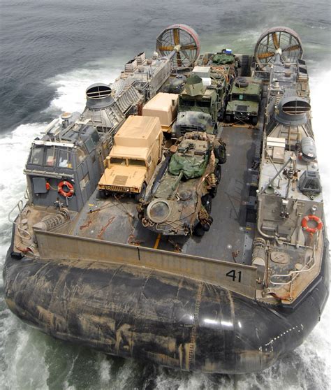 A Landing Craft Air Cushion Lcac Leaves The Well Deck Aboard Uss Iwo