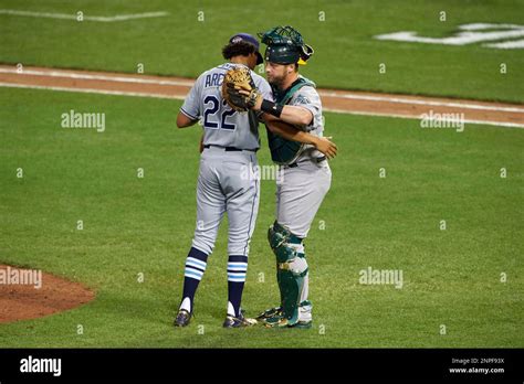 Tampa Bay Rays Pitcher Chris Archer Hugs Oakland Athletics Catcher