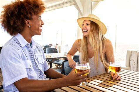 Young Multiracial Couple On Vacation Enjoying Time Together Laughing