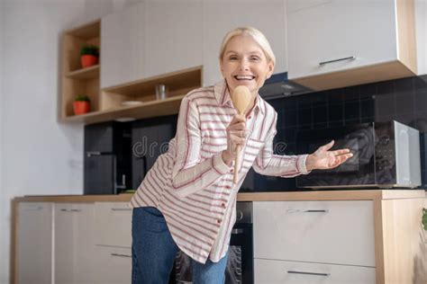 Blonde Housewife Having Fun In The Kitchen And Smiling Stock Photo Image Of Indoors Pretty