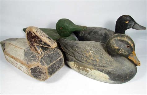 LOT OF 4 VINTAGE WOODEN DUCK DECOYS