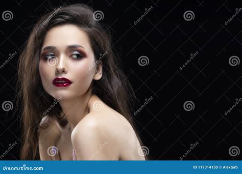Portrait Of A Beautiful Glamorous Brunette Girl With Naked Shoulders Shimmering Makeup Red