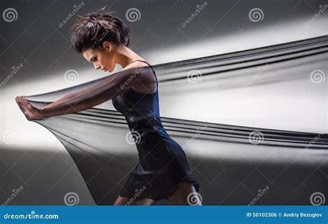 Graceful Brunette Stretches Stretch Mesh Fabric In Front Of You Stock Photo Image Of