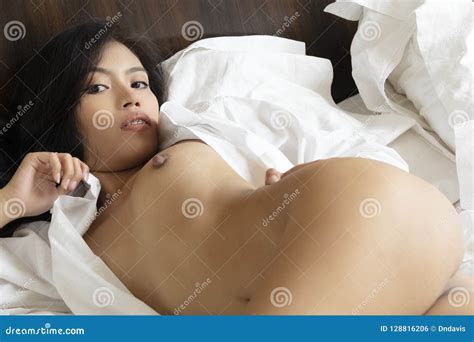 Beautiful Asian Woman Posing Nude On White Sheets Stock Photo Image Of Flirt Bedroom